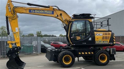 The JCB JS160W wheeled excavator at a construction site