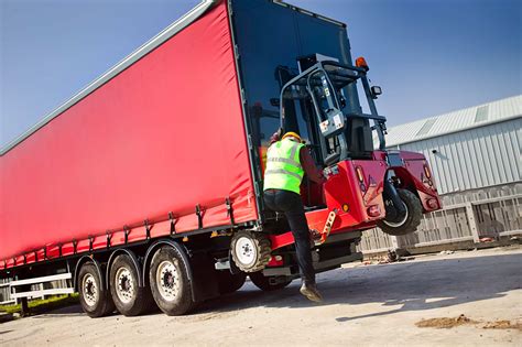 Thematic photo of a truck-mounted forklift attached to the back of a lorry, ready for use
