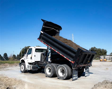 Thematic photo of a dump truck in operation