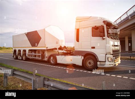 Thematic photo of a modern semi-trailer truck on a highway