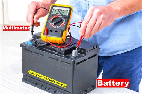 Photo of a multimeter testing a lawn tractor battery