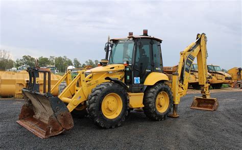 The Komatsu WB97S backhoe loader at work on a construction site