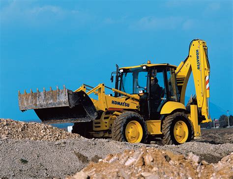 Komatsu WB97S backhoe loader performing excavation work