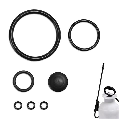 Photo of various sprayer spare parts (seals, nozzles, O-rings, pump components)