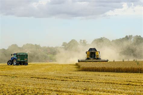 Thematic photo of a tractor working in a field during summer heat