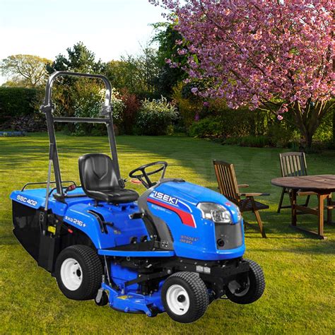 The Iseki SXG 216+ professional ride-on mower in action on a well-maintained lawn, showing its compact yet robust design.