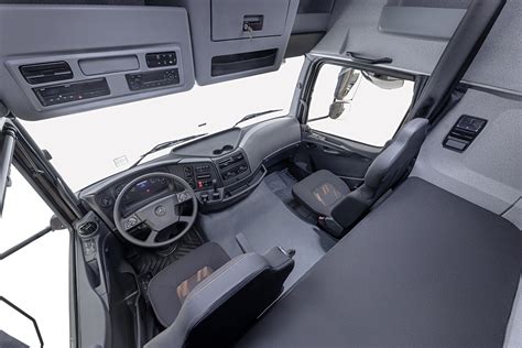Interior view of Mercedes-Benz Axor truck cabin, highlighting dashboard and spaciousness