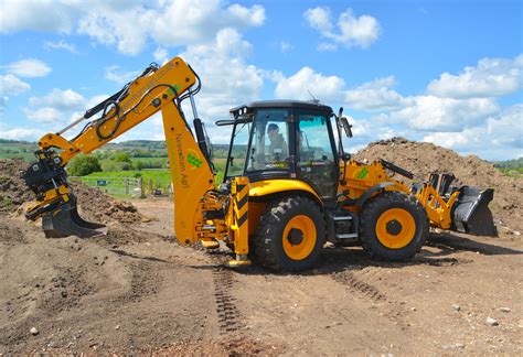 Thematic photo of a backhoe loader working on a farm field