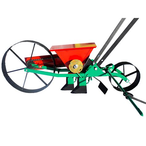 Siewnik taczkowy do warzyw z widocznym mechanizmem siewnym