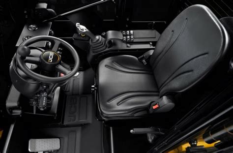 Interior view of the JCB 403E cabin with the digital display and joystick controls.