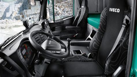Interior photo of an Iveco Trakker Hi-Track cabin, showing dashboard and seating