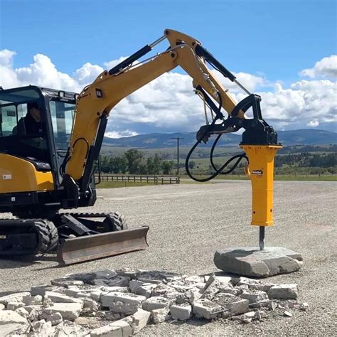 Photo of a mini excavator with a hydraulic hammer attached
