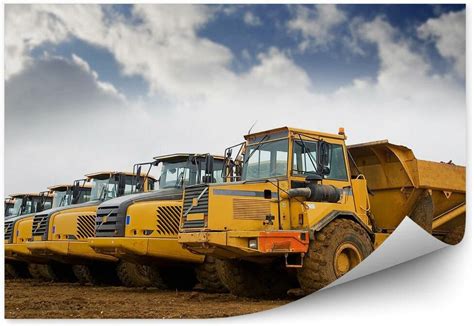 Tematyczne zdjęcie wywrotek na budowie z materiałami sypkimi