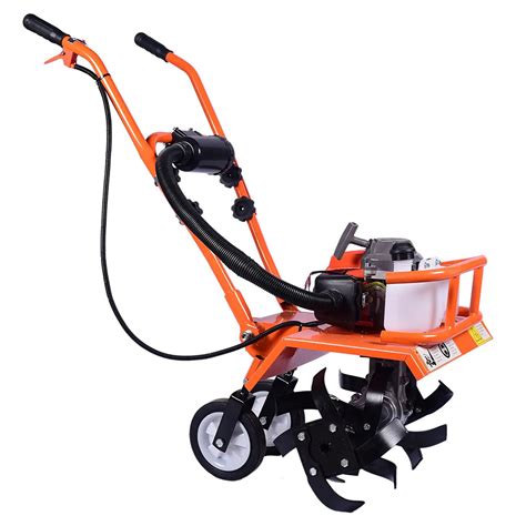 Thematic photo of a petrol rotary tiller working in a garden