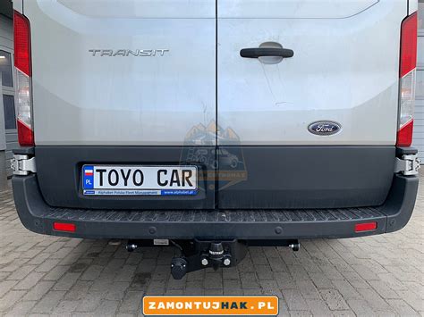 Zdjęcie przedstawiające tył Forda Transita z otwartą skrzynią wywrotki