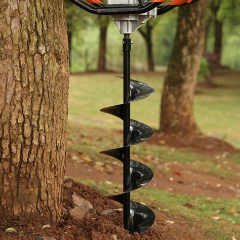 Thematic photo of a person working in the garden with a gasoline auger