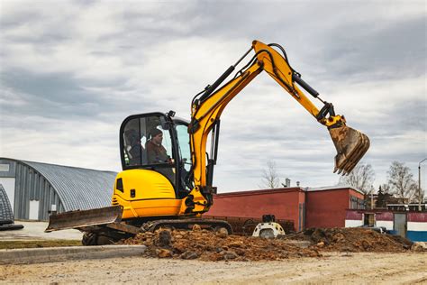 Thematic photo of a mini excavator working on a construction site in Rybnik, with a focus on precision and efficiency