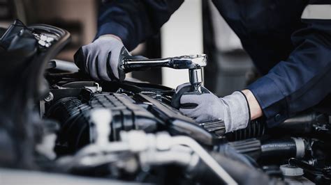Photo of a JCB service vehicle with mechanics performing on-site repairs