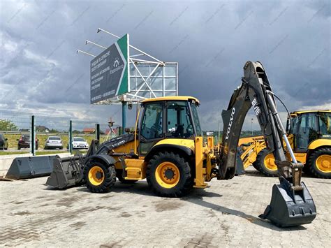 Thematic photo of a Volvo BL71 backhoe loader working on a construction site