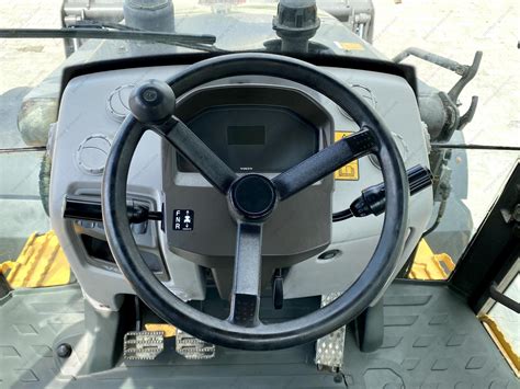 Interior photo of a Volvo BL71 cabin, showing controls and operator seat