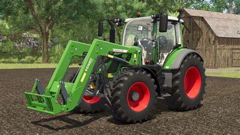 A Fendt compact tractor with a front loader working on a large estate