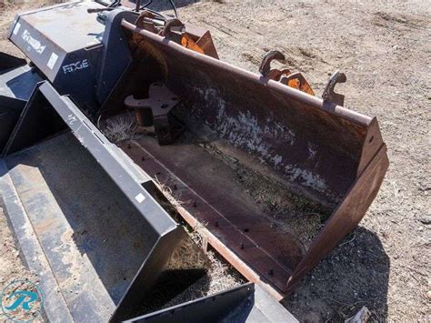 Close-up of the front loader (crocodile type bucket) on an MTZ 82 backhoe loader