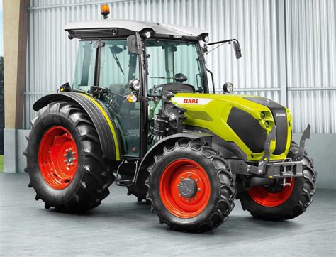 Photo of Claas ELIOS tractor working in an orchard or vineyard