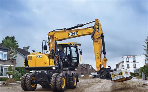 Thematic photo of a JCB wheeled excavator working on a construction site