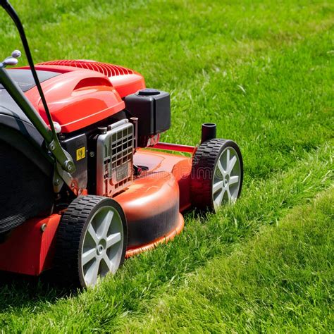 Thematic photo of a lawnmower, possibly with a visible shaft or engine part