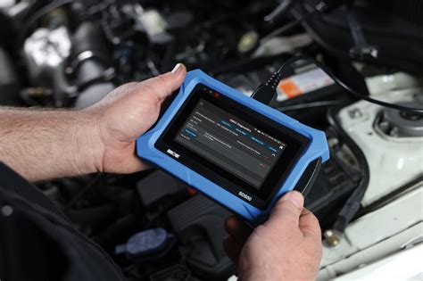 Photo of a diagnostic device connected to a Bobcat machine