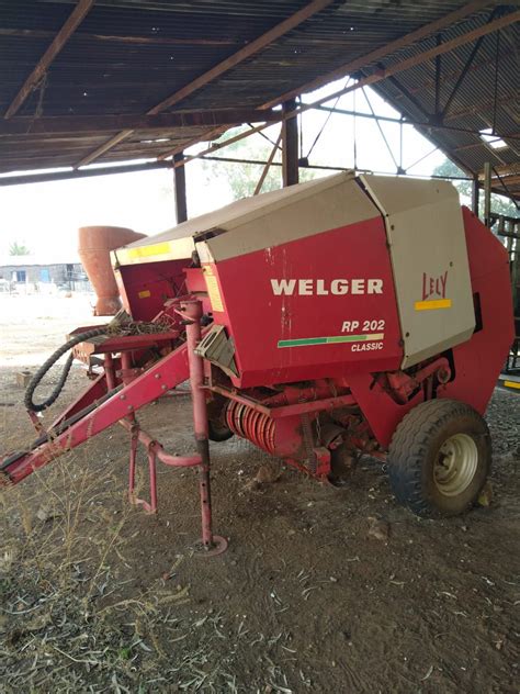 Thematic photo of a Lely round baler at work in a field