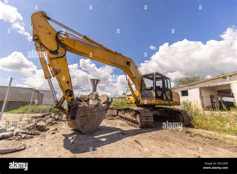 Thematic photo of a large JCB crawler excavator working on a construction site