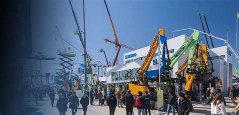 The XCMG stand at Bauma showcasing a wide range of construction machinery, with a focus on excavators and loaders.