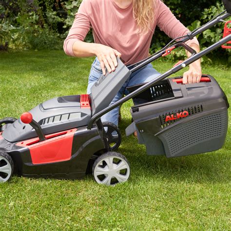 The AL-KO SILVER 46.4 COMFORT electric lawnmower in a garden setting, highlighting its compact design