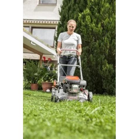 Photo of an AL-KO petrol lawnmower in action on a large lawn