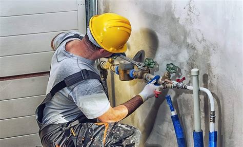 Thematic photo of a plumber working on pipes or a WUKO machine in action.