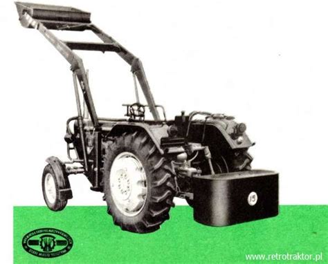 Zdjęcie z prospektu reklamowego ładowacza T-210 TUR zamontowanego na C-330, z widoczną skrzynią przeciwwagi z tyłu