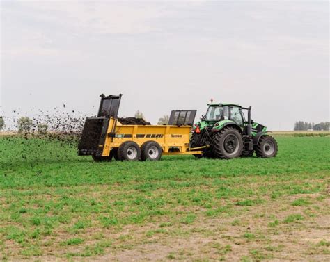 Thematic photo of Agrimat manure spreader in operation on a field