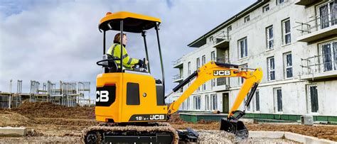 Thematic photo of a JCB mini excavator working in an urban environment