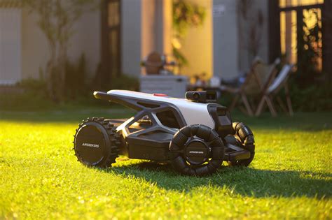 The MacAllister robotic lawnmower operating on a green lawn