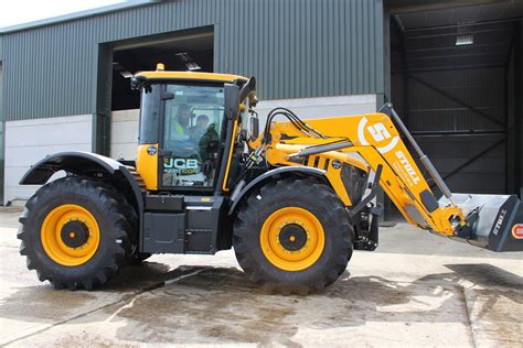 Thematic photo of a STOLL front loader at work on a farm, showing its sturdy construction.