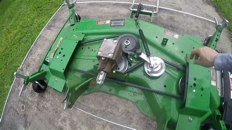 Diagram of a two-blade cutting deck with anti-scalp wheels