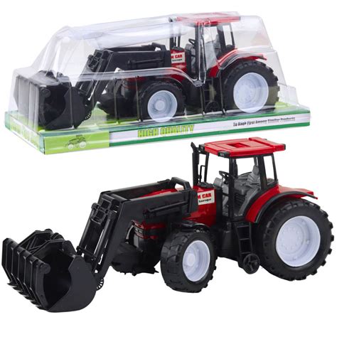 Zabawkowy traktor Valtra z dzieckiem bawiącym się na tle pola