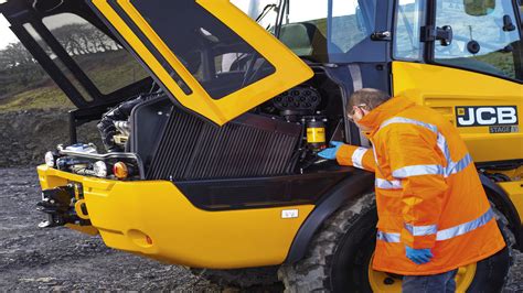 Thematic photo of a JCB machine undergoing maintenance, showing the arm or bucket area
