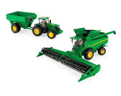 Zabawkowy traktor Bruder John Deere z rozrzutnikiem obornika i figurką