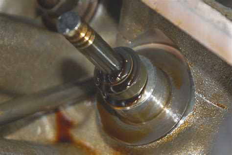 Photo of a disassembled hydraulic valve with visible worn seals