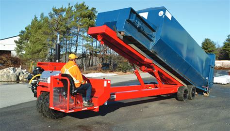 The Cyklop loader in action, loading agricultural produce onto a trailer