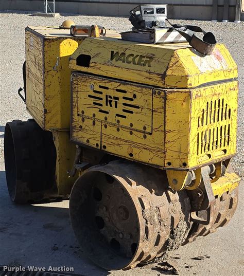 Thematic photo of a Wacker Neuson compactor with an emphasis on the engine or carburetor