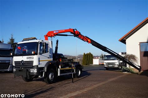 Zdjęcie ciężarówki MAN Euro 6 4x4 z zabudową hakowiec