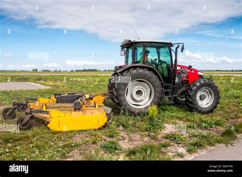 Thematic photo showing a robust Czech rotary mower in a field during harvest